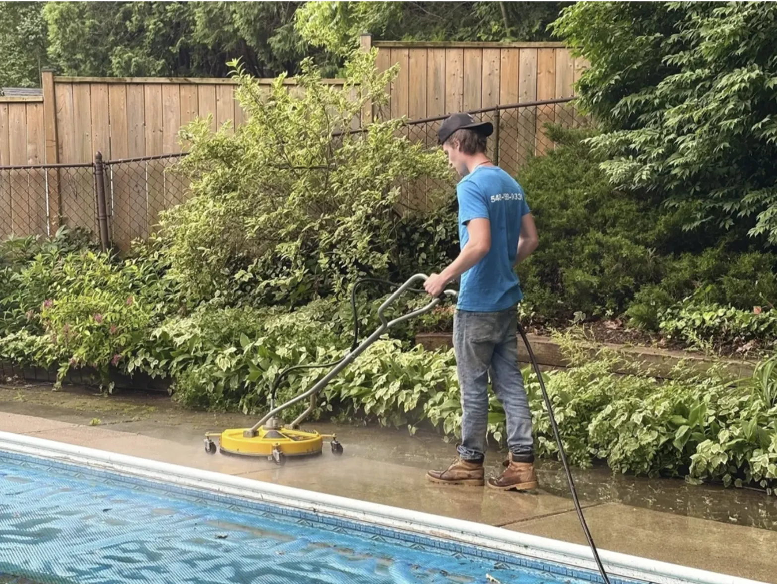 PowerShine team cleaning a driveway